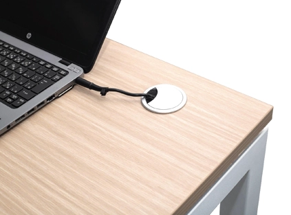Close-up of the smart cable grommet on VOT402 desk surface.
